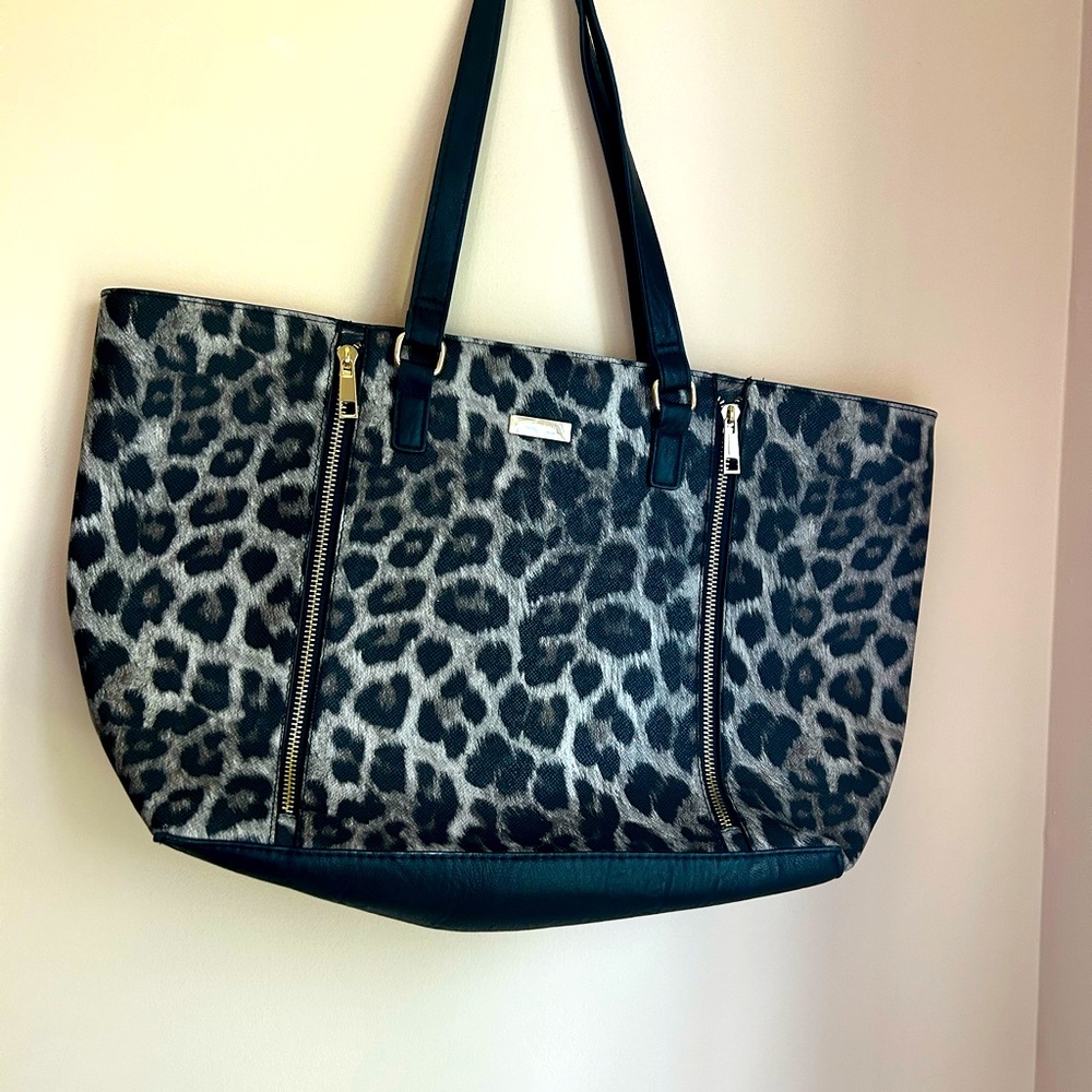 New animal print tote bag with red lining.